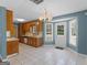 Traditional eat-in kitchen boasts tile floors, wood cabinets, and a door to the backyard at 105 Birch Creek Cir, Mcdonough, GA 30253