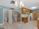 Bright open kitchen, seamlessly connected to other spaces, featuring white appliances and tile floor at 105 Birch Creek Cir, Mcdonough, GA 30253