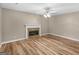 The living room features a fireplace and hardwood floors, creating a cozy and inviting atmosphere at 105 Birch Creek Cir, Mcdonough, GA 30253