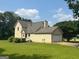 Rear exterior showcasing the home's siding, attached garage, and well-maintained lawn, perfect for outdoor enjoyment at 105 Birch Creek Cir, Mcdonough, GA 30253