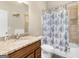 Bathroom featuring granite countertop vanity, tile flooring, and a shower-tub combination at 570 Mcgarity Dr, Mcdonough, GA 30252