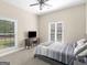 Comfortable bedroom featuring neutral walls, carpeted floors, and a full-sized bed with a view of the exterior at 570 Mcgarity Dr, Mcdonough, GA 30252