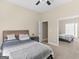 Bedroom boasts a comfortable bed, soft carpet, mirrored closet, and ample natural light at 570 Mcgarity Dr, Mcdonough, GA 30252