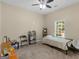 Bedroom with neutral tones, window view, ceiling fan, and playful decorations at 570 Mcgarity Dr, Mcdonough, GA 30252