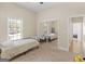 Bedroom featuring a window view, mirrored closet, and view of the hall way at 570 Mcgarity Dr, Mcdonough, GA 30252