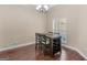 Dining room with hardwood floors, a window, and a wooden table with seating for four at 570 Mcgarity Dr, Mcdonough, GA 30252