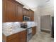 Updated kitchen with granite countertops, stainless steel appliances, and stylish backsplash at 570 Mcgarity Dr, Mcdonough, GA 30252
