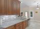 Modern kitchen with granite countertops, stainless steel appliances, and dark wood cabinetry at 570 Mcgarity Dr, Mcdonough, GA 30252