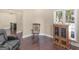 Living room showcasing hardwood floors, neutral walls, and a comfortable seating arrangement with side tables at 570 Mcgarity Dr, Mcdonough, GA 30252