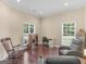 Bright living area with hardwood floors, comfortable seating, and natural light from multiple windows at 570 Mcgarity Dr, Mcdonough, GA 30252