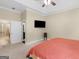 Large main bedroom featuring a king-sized bed, and a tv with an ensuite bathroom at 570 Mcgarity Dr, Mcdonough, GA 30252