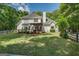 Spacious backyard with deck and white fencing at 857 Cooper Rd, Social Circle, GA 30025