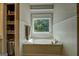 Bathroom with a soaking tub with window and natural light at 857 Cooper Rd, Social Circle, GA 30025