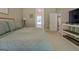 Spacious bedroom with a view to the en suite bath and lots of natural light at 857 Cooper Rd, Social Circle, GA 30025