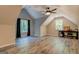 Large bonus room with hardwood floors, vaulted ceilings, and abundant natural light at 857 Cooper Rd, Social Circle, GA 30025