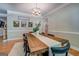 Dining room featuring a large rustic table and stylish decor at 857 Cooper Rd, Social Circle, GA 30025