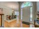 Elegant foyer featuring hardwood floors and views into the dining room at 857 Cooper Rd, Social Circle, GA 30025
