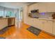 Updated kitchen featuring white cabinets and sleek appliances at 857 Cooper Rd, Social Circle, GA 30025