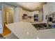 Bright kitchen features white cabinets, stainless steel appliances and stone countertops at 857 Cooper Rd, Social Circle, GA 30025