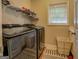 Modern laundry room with front load washer and dryer at 857 Cooper Rd, Social Circle, GA 30025