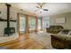 Cozy living room with hardwood floors, a vintage wood-burning stove, and comfortable seating at 857 Cooper Rd, Social Circle, GA 30025