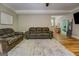 Comfortable living room with hardwood floors and a cozy couch at 857 Cooper Rd, Social Circle, GA 30025