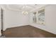 Formal dining room featuring hardwood floors, coffered ceiling, and natural light from large windows at 1841 N Lacebark Elm Way # 101, Lawrenceville, GA 30045