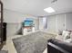 Finished basement featuring a large area rug, comfortable seating, and stylish doors at 715 Frog Rd, Locust Grove, GA 30248