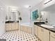 A traditional bathroom with double sinks and a jacuzzi style tub at 715 Frog Rd, Locust Grove, GA 30248