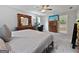 Spacious primary bedroom with a king bed, desk, and TV; bathroom is in the background at 715 Frog Rd, Locust Grove, GA 30248
