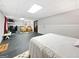 Large bedroom features a unique brick accent wall, comfortable seating and bright lighting at 715 Frog Rd, Locust Grove, GA 30248