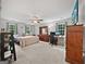 Spacious primary bedroom featuring carpet, natural light, and wood furniture at 715 Frog Rd, Locust Grove, GA 30248