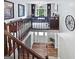 View from stairs of foyer, featuring a study area and front door, enhanced by natural light at 715 Frog Rd, Locust Grove, GA 30248