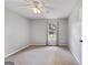 Bedroom features neutral paint, carpet floors, and a window at 401 Grove Pointe Ct, Locust Grove, GA 30248