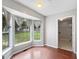 Bright dining area with bay window, hardwood floors, and adjacent closet at 401 Grove Pointe Ct, Locust Grove, GA 30248