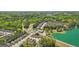 Aerial view of neighborhood with lake nearby, featuring well-maintained homes and green spaces at 5237 Halcyon Ct, Morrow, GA 30260