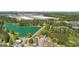 Aerial view of home near a lake and an industrial complex, nestled among trees and residential areas at 5237 Halcyon Ct, Morrow, GA 30260