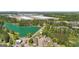 Aerial view of home near a lake and an industrial complex, nestled among trees and residential areas at 5237 Halcyon Ct, Morrow, GA 30260