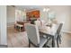 Open-concept dining area featuring a modern table set and hardwood floors at 5237 Halcyon Ct, Morrow, GA 30260