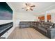 Open-concept living room featuring a fireplace and modern gray seating at 5237 Halcyon Ct, Morrow, GA 30260