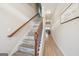 Elegant staircase featuring wooden railings and light-colored steps at 5237 Halcyon Ct, Morrow, GA 30260