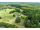 Expansive property showcasing the home, outbuildings, pastures, and surrounding forest from above at 382 Knox Chapel Rd, Social Circle, GA 30025