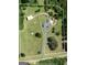 Stunning aerial view of a home with a circular driveway and large acreage surrounded by mature trees at 382 Knox Chapel Rd, Social Circle, GA 30025
