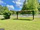 Backyard features a hammock suspended from a pergola, creating a relaxing outdoor retreat with a garden at 382 Knox Chapel Rd, Social Circle, GA 30025