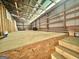 Wood-framed barn interior showing a raised level, plywood walls and gravel floor at 382 Knox Chapel Rd, Social Circle, GA 30025