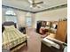 Cozy bedroom with carpet flooring, natural lighting, and desk space at 382 Knox Chapel Rd, Social Circle, GA 30025