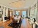 Elegant dining room with striped wallpaper, a large table, and a decorative hutch at 382 Knox Chapel Rd, Social Circle, GA 30025