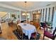 Spacious dining room with a hardwood floor, an adjacent seating area, and a furniture hutch at 382 Knox Chapel Rd, Social Circle, GA 30025