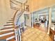 Inviting foyer features a grand staircase, tile flooring, and an open view into the dining and living areas at 382 Knox Chapel Rd, Social Circle, GA 30025