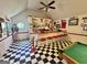 Charming game room boasting a bar area, pool table, and checkered flooring for a fun and relaxed atmosphere at 382 Knox Chapel Rd, Social Circle, GA 30025